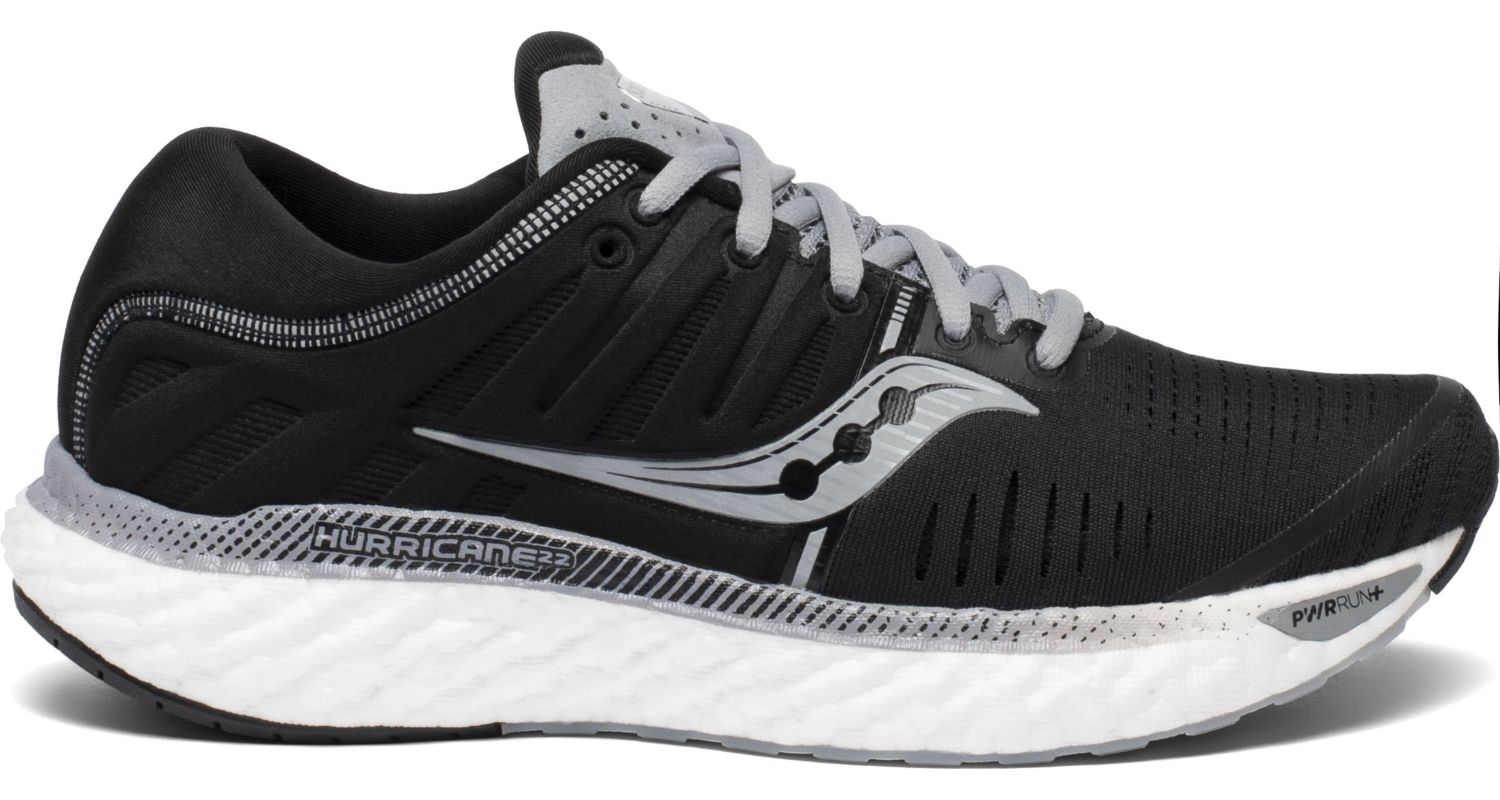 Saucony Women's Hurricane 22 Running Shoe in Black/White from the side