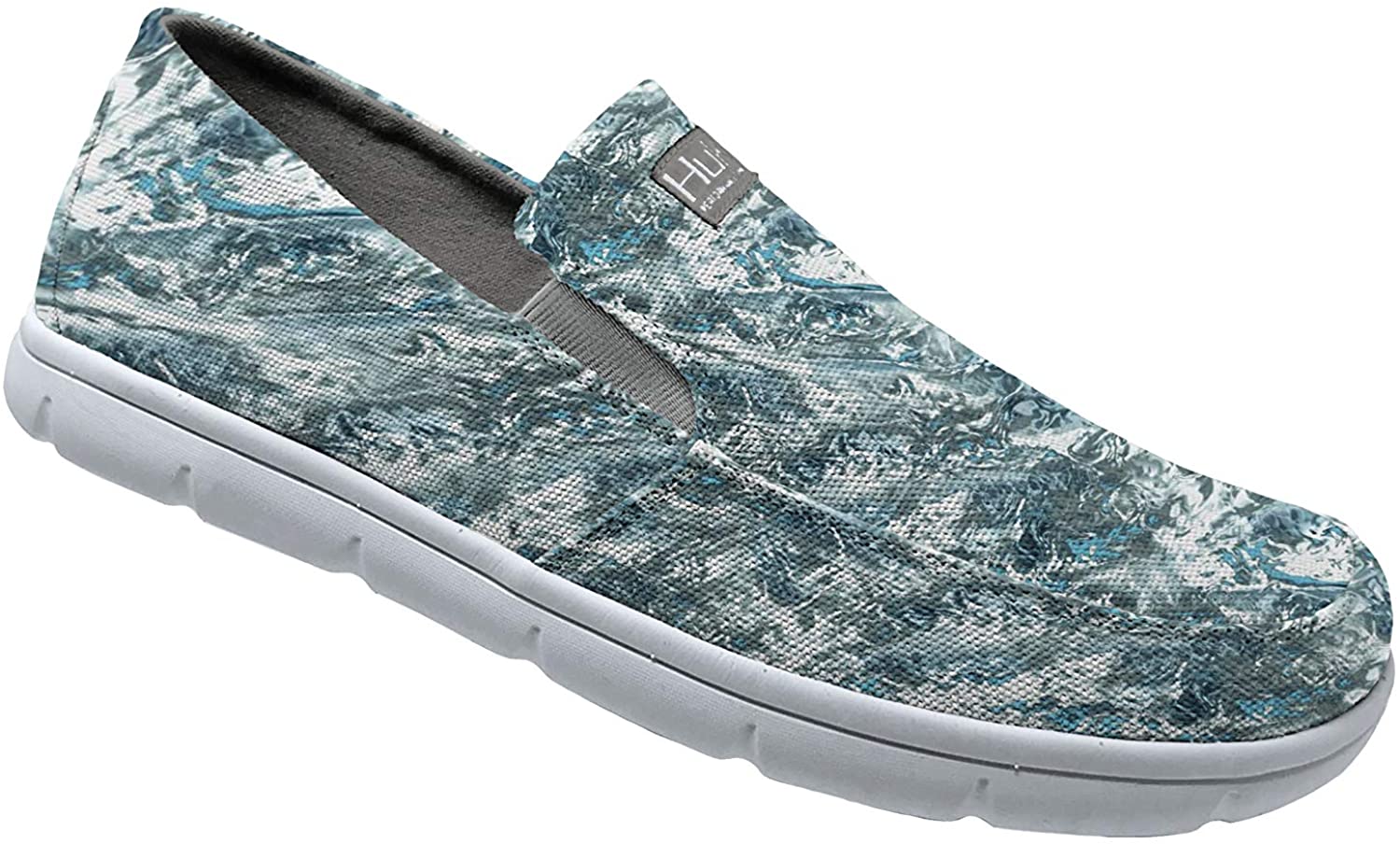 Men's Huk Brewster Print Slip-On Shoe in Mossy Oak Hydro Standards from the side