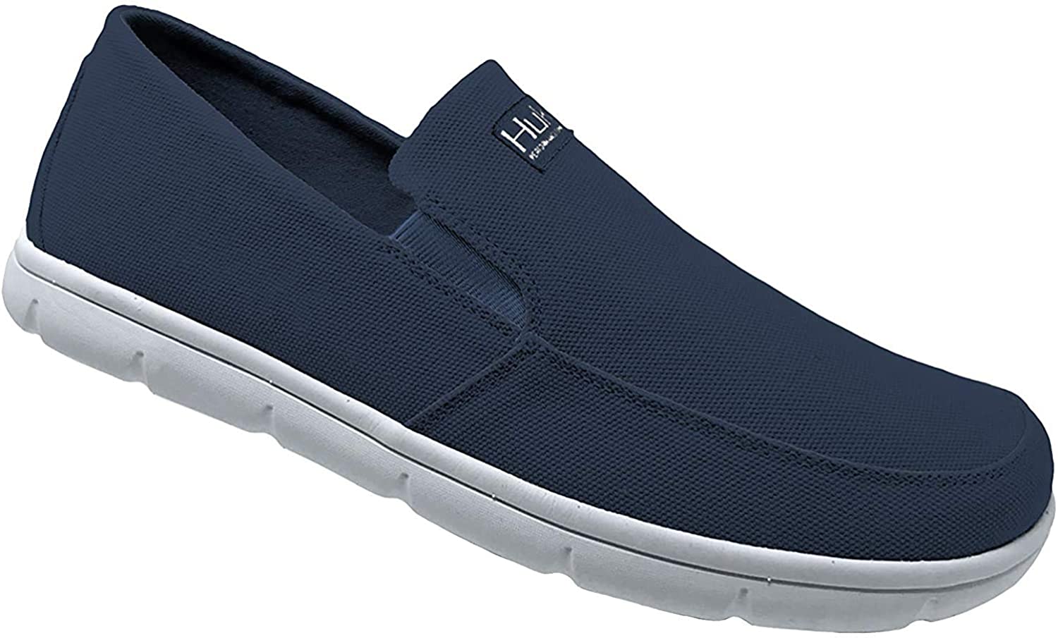Men's Huk Brewster Solid Slip-On Shoe in Sargasso Sea from the side