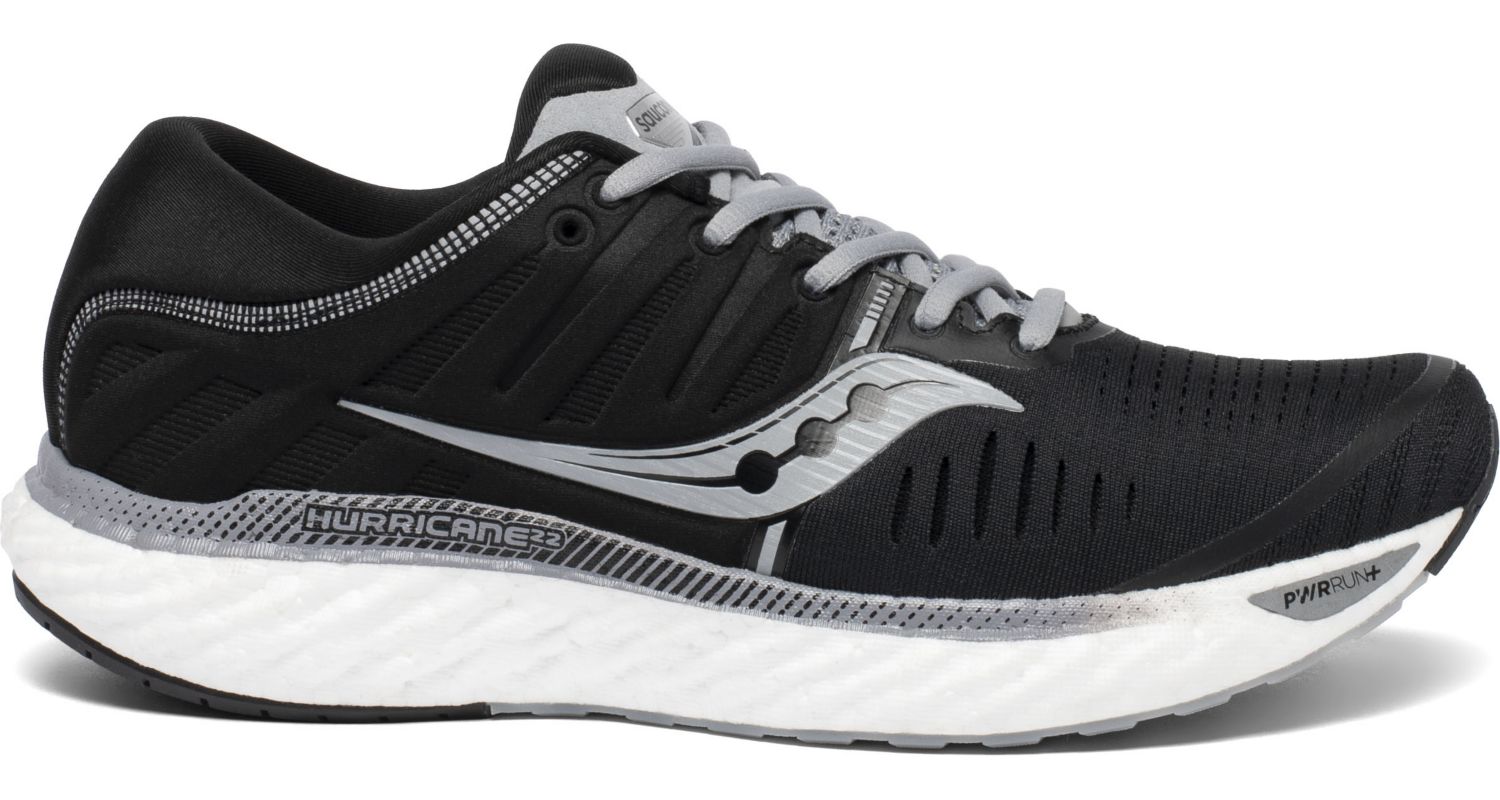 Saucony Men's Hurricane 22 Running Shoe in Black/White from the side